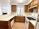 Kitchen with stainless steel sink, oak cabinets and laminate countertops at 2160 Highpointe Dr # 102, Laughlin, NV 89029