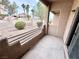 A covered patio with view to desert landscaping featuring decorative rock and palm trees in an HOA community at 2160 Highpointe Dr # 102, Laughlin, NV 89029