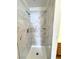 Remodeled shower featuring marble-style tiling and shelves at 2160 Highpointe Dr # 102, Laughlin, NV 89029