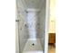 Remodeled shower featuring marble-style tiling and shelves at 2160 Highpointe Dr # 102, Laughlin, NV 89029