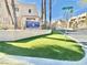 A view of the Colorado Bay Club entrance and community signage near lush landscaping at 2160 Highpointe Dr # 102, Laughlin, NV 89029