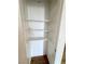 Hall closet featuring three tiers of shelving and white interior at 2160 Highpointe Dr # 102, Laughlin, NV 89029