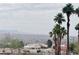 Scenic view from the property with lush palm trees, city, and mountain views at 2160 Highpointe Dr # 102, Laughlin, NV 89029