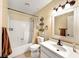 Cozy bathroom featuring a shower-tub combo, vanity, and a classic hexagon tile floor at 2204 Short Pine Dr, Las Vegas, NV 89108