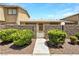 Charming front entrance featuring desert landscaping, a decorative gate, and a well-maintained walkway at 2204 Short Pine Dr, Las Vegas, NV 89108