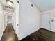 Hallway featuring a sleek hardwood floor that leads to multiple rooms, and a neutral color palette at 2204 Short Pine Dr, Las Vegas, NV 89108