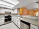 This cozy kitchen features stainless steel appliances and a skylight at 2204 Short Pine Dr, Las Vegas, NV 89108