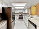Bright kitchen features white cabinets, stainless steel appliances, and hexagon tile floors at 2204 Short Pine Dr, Las Vegas, NV 89108
