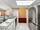 This kitchen has stainless appliances and tile floors at 2204 Short Pine Dr, Las Vegas, NV 89108