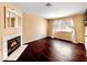 Spacious living room has a fireplace and a large window with sheer curtains at 2204 Short Pine Dr, Las Vegas, NV 89108