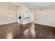 Open living room featuring wood flooring and an adjacent kitchen area, with natural light at 2204 Short Pine Dr, Las Vegas, NV 89108