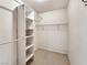 Organized walk-in closet with built-in shelving and ample storage space, finished with classic hexagon tile flooring at 2204 Short Pine Dr, Las Vegas, NV 89108