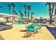 A community pool area with lounge chairs and palm trees offers a relaxing outdoor experience at 2725 S Nellis Blvd # 1037, Las Vegas, NV 89121