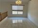 Tile dining room with chandelier and large window at 2728 Aspen Wood Ave, Henderson, NV 89074