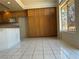 Bright eat-in kitchen area with tile floors, large cabinets, and natural light at 2728 Aspen Wood Ave, Henderson, NV 89074