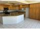 Bright kitchen with large island, tile floors, and granite countertops at 2728 Aspen Wood Ave, Henderson, NV 89074