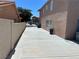 Spacious side yard with extended driveway offering extra parking and access to the backyard at 2728 Aspen Wood Ave, Henderson, NV 89074