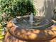 Inviting outdoor water feature adds a touch of tranquility to the home's exterior landscaping at 2728 Aspen Wood Ave, Henderson, NV 89074