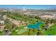 An aerial view of the Las Vegas Country Club, showcasing the homes, golf course, and city skyline at 2845 Queens Courtyard Dr, Las Vegas, NV 89109