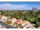 This elevated view shows the homes backing onto the manicured greens and ponds of the Las Vegas Country Club at 2845 Queens Courtyard Dr, Las Vegas, NV 89109