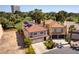 Aerial view showcases the property with a red tile roof and well-maintained landscape at 2845 Queens Courtyard Dr, Las Vegas, NV 89109