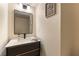 Chic powder room featuring a sleek vanity and modern fixtures, creating a stylish space at 2845 Queens Courtyard Dr, Las Vegas, NV 89109