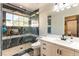 Bathroom with a shower and marble-look accent wall at 2845 Queens Courtyard Dr, Las Vegas, NV 89109