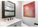 Cozy bathroom features a patterned shower and a decorative framed mirror at 2845 Queens Courtyard Dr, Las Vegas, NV 89109