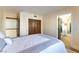 Bedroom featuring multiple doorways, a double closet and wood-look floors at 2845 Queens Courtyard Dr, Las Vegas, NV 89109