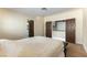 A bright bedroom offers multiple doorways and unique wood-look floors at 2845 Queens Courtyard Dr, Las Vegas, NV 89109