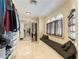 Organized walk-in closet with custom shelving, seating, and natural light from arched windows at 2845 Queens Courtyard Dr, Las Vegas, NV 89109