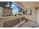 Balcony view framed by stucco railing and decorative columns overlooking the community at 2995 E Sunset Rd # 134, Las Vegas, NV 89120