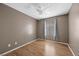 Bedroom with wood flooring, ceiling fan, and window at 2995 E Sunset Rd # 134, Las Vegas, NV 89120