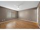 Bedroom with wood flooring, ceiling fan, and window at 2995 E Sunset Rd # 134, Las Vegas, NV 89120