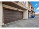 Garage facade showcases brown doors and stucco walls with convenient access to units at 2995 E Sunset Rd # 134, Las Vegas, NV 89120