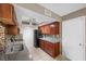 Updated kitchen features granite countertops, stainless steel appliances, tile backsplash, and wood cabinets at 2995 E Sunset Rd # 134, Las Vegas, NV 89120