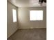 Carpeted bedroom featuring two windows and neutral color scheme at 3021 New Journey Way, North Las Vegas, NV 89031