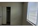 Bedroom featuring a large window with blinds and closet with sliding doors at 3021 New Journey Way, North Las Vegas, NV 89031