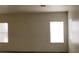 Bedroom with carpet floors and two windows at 3021 New Journey Way, North Las Vegas, NV 89031