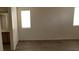 Bright bedroom featuring wood-look floors, a window, and an adjacent bathroom at 3021 New Journey Way, North Las Vegas, NV 89031