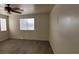 Spacious bedroom with a ceiling fan, window, and carpeted flooring at 3021 New Journey Way, North Las Vegas, NV 89031
