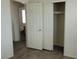 Bedroom with closet with sliding doors leading to en-suite bathroom at 3021 New Journey Way, North Las Vegas, NV 89031