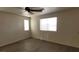 Bedroom with a ceiling fan, multiple windows, and laminate flooring at 3021 New Journey Way, North Las Vegas, NV 89031