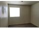 Bedroom featuring a window with blinds and gray carpeted flooring at 3021 New Journey Way, North Las Vegas, NV 89031