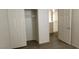 White closet door is opened to show shelving, opening up into a room with tan carpet at 3021 New Journey Way, North Las Vegas, NV 89031