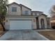 Charming two-story home with a spacious two-car garage and concrete driveway at 3021 New Journey Way, North Las Vegas, NV 89031