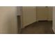 Hallway with neutral colored walls, baseboards, and tan carpeted flooring at 3021 New Journey Way, North Las Vegas, NV 89031