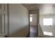 Hallway with a partial view of a room featuring a ceiling fan at 3021 New Journey Way, North Las Vegas, NV 89031