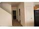 Functional hallway showing access to a laundry room and a stairway to an upper level at 3021 New Journey Way, North Las Vegas, NV 89031