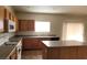 Bright kitchen has a functional layout, neutral counters, island, and essential appliances for easy cooking at 3021 New Journey Way, North Las Vegas, NV 89031